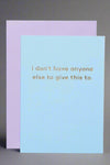 A greeting card in baby blue color with gold text that reads ‘I don’t have anyone else to give this to.