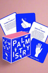 Box of 50 cards to learn how to read palms. Royal blue box with pink details.