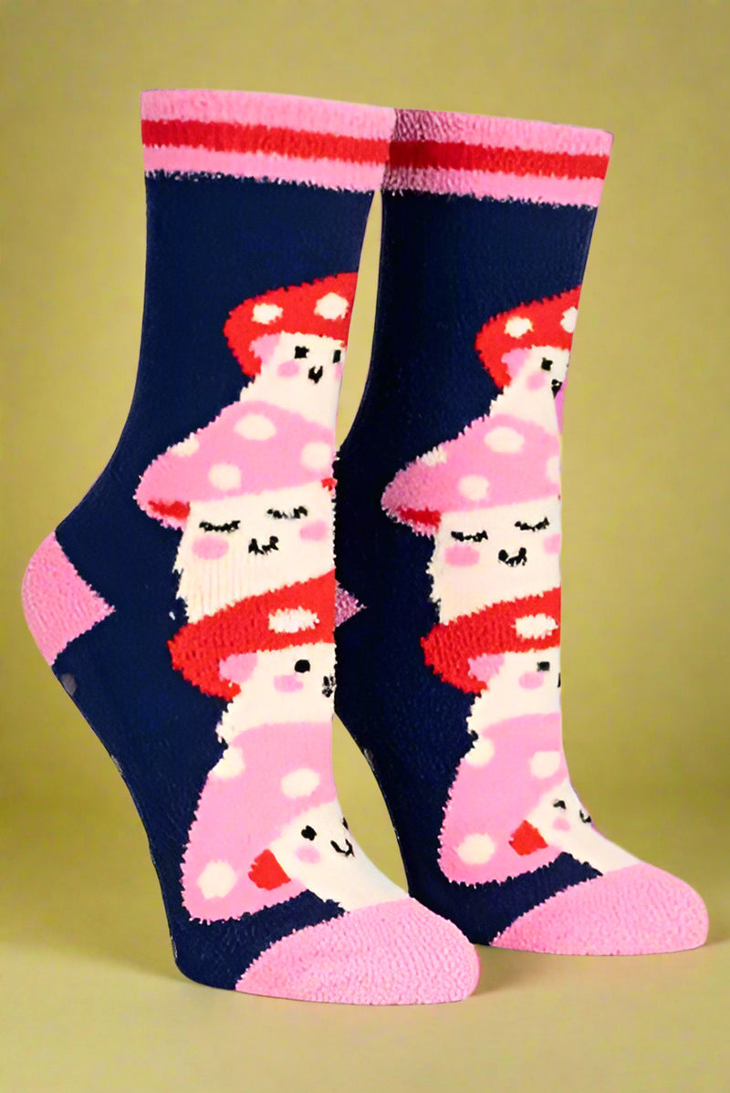 Navy blue socks with pink and red mushroom design on a light gray background