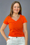 A women’s basic short sleeve v-neck cotton tee in bright orange.