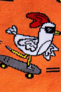 Chicken on a skateboard with a red hat on an orange background