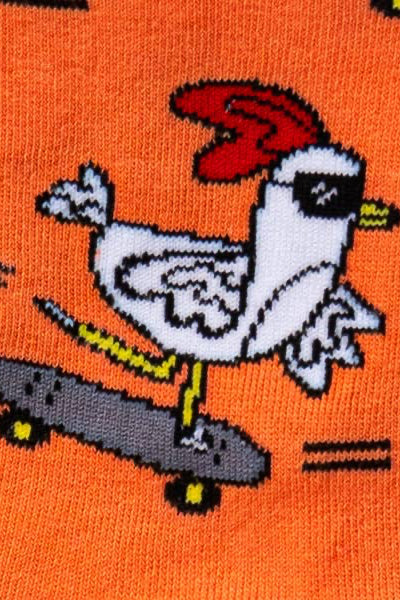 Chicken on a skateboard with a red hat on an orange background
