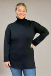A women’s medium weight long sleeve turtle neck sweater tunic in black with gold button detail on sleeve cuffs.