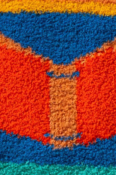 Close-up of a textured fabric with multicolor pattern