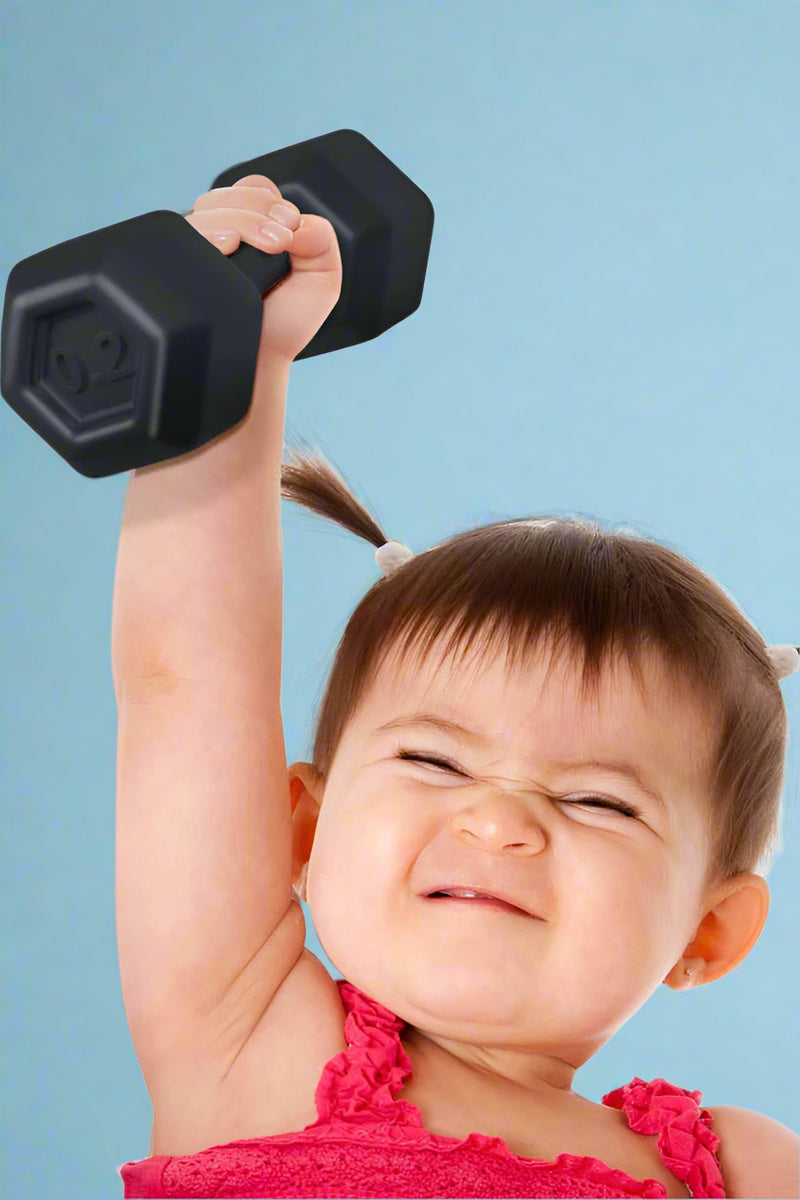 Child lifting a black dumbbell against a white background
