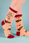 Socks with cartoon school buses and text on a white background