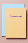 A peach colored card with “You’ve changed” in purple letters.