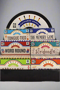 A display of multiple simple ‘on-the-go’ games. Game packaging resembles large matchboxes.