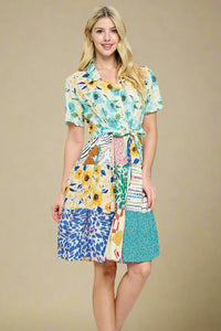 Model is wearing a patchwork dress. 