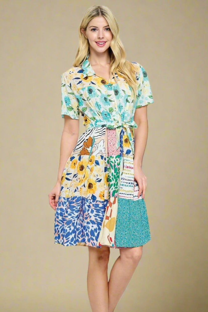 Model is wearing a patchwork dress. 