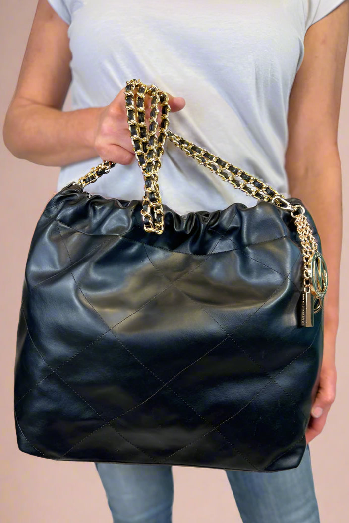 Large quilted black shoulder bag with chain strap. 