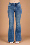 Blue flared jeans on a plain background.