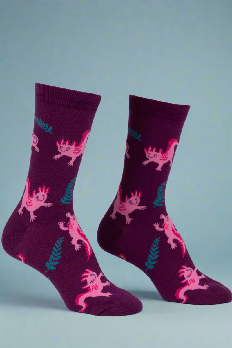 Pair of purple socks with pink character design on a white background
