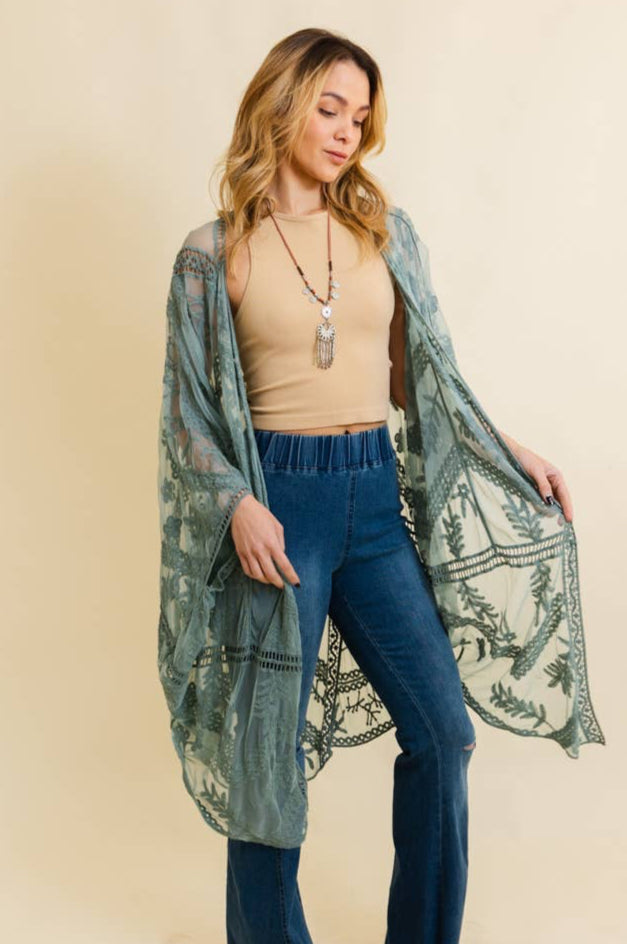 Model is wearing a sage green embroidered lace kimono.  