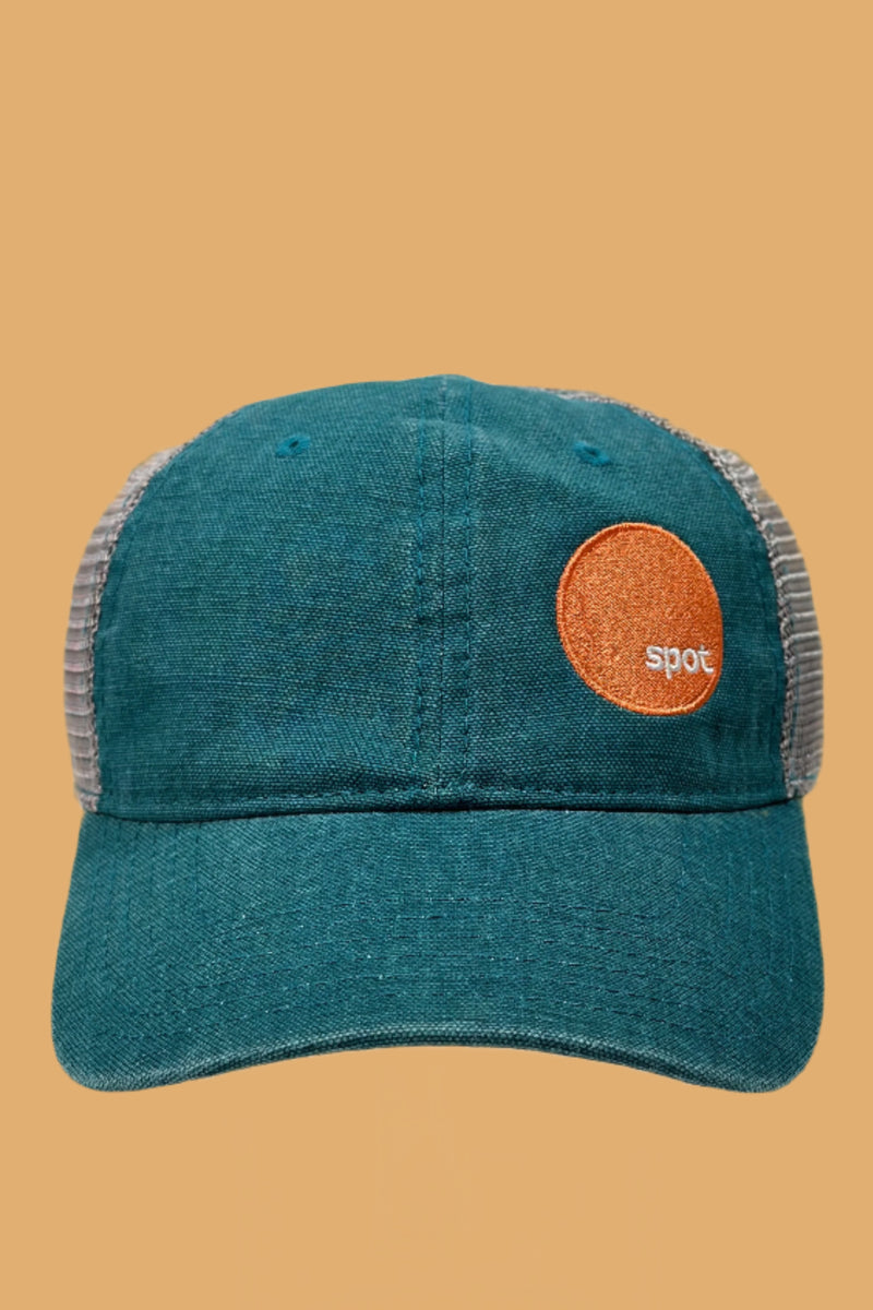 Deep teal colored baseball cap with a contrasting grey mesh back and an embroidered Spot logo.