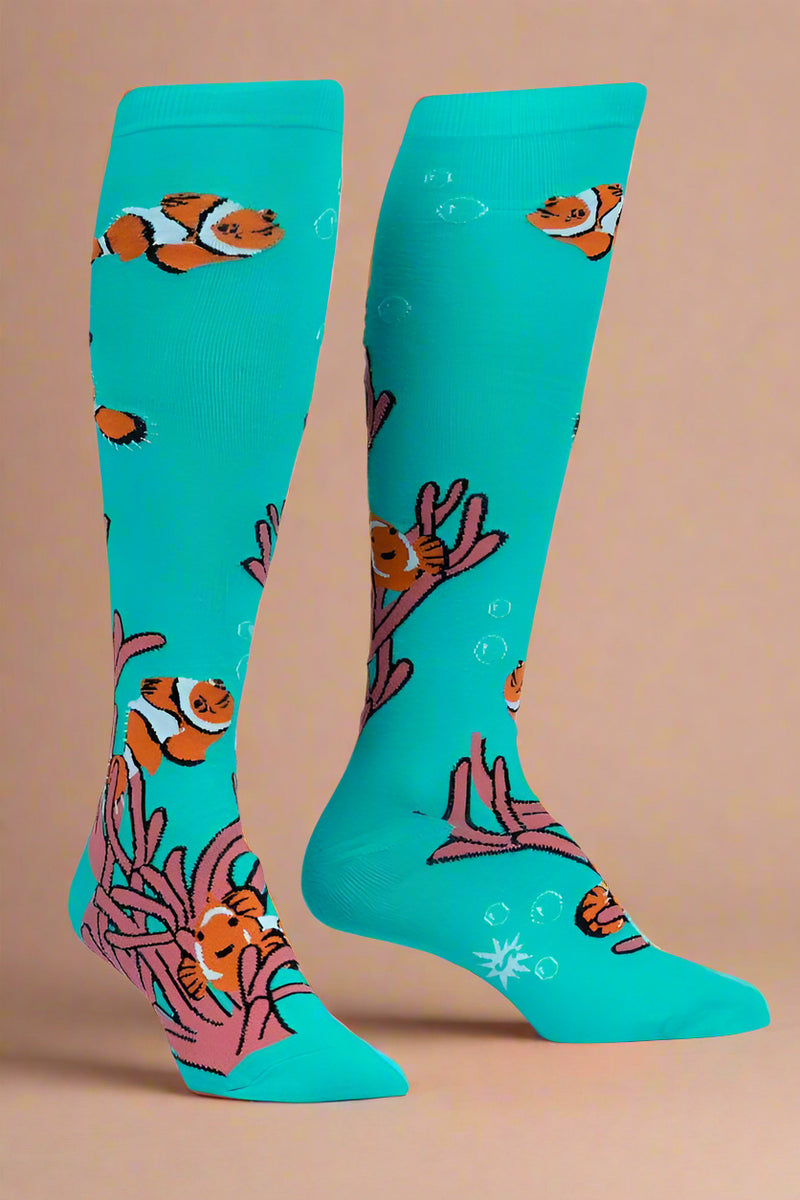 Turquoise knee-high socks with clownfish design on a white background