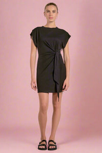 Black dress worn by a model on a white background