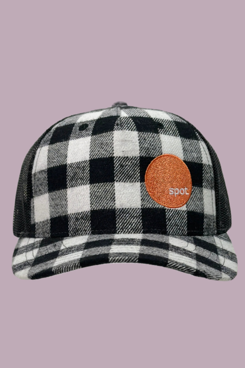 Black and white buffalo plaid printed mesh back trucker hat with an embroidered Spot logo.