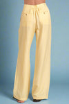 Yellow pants on a plain background