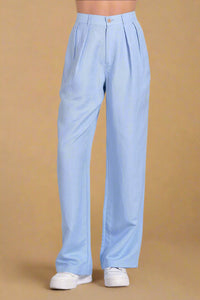 Light blue pants worn by a person on a plain background