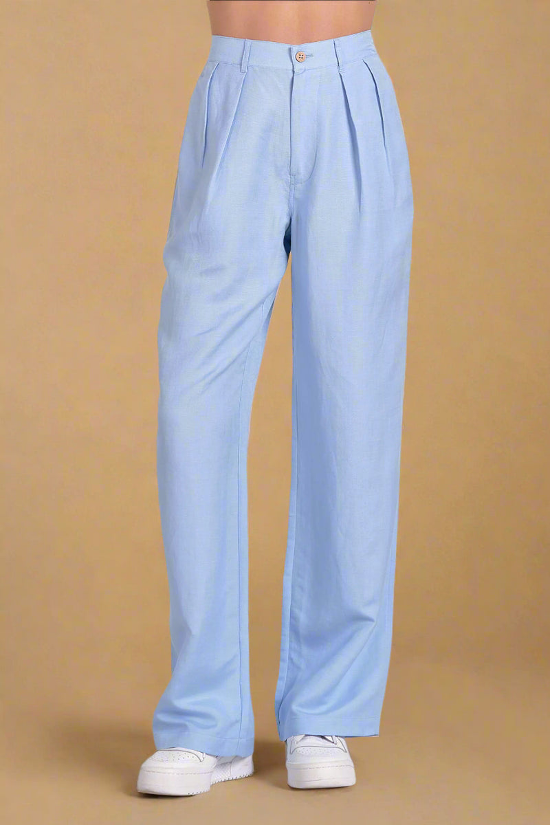 Light blue pants worn by a person on a plain background