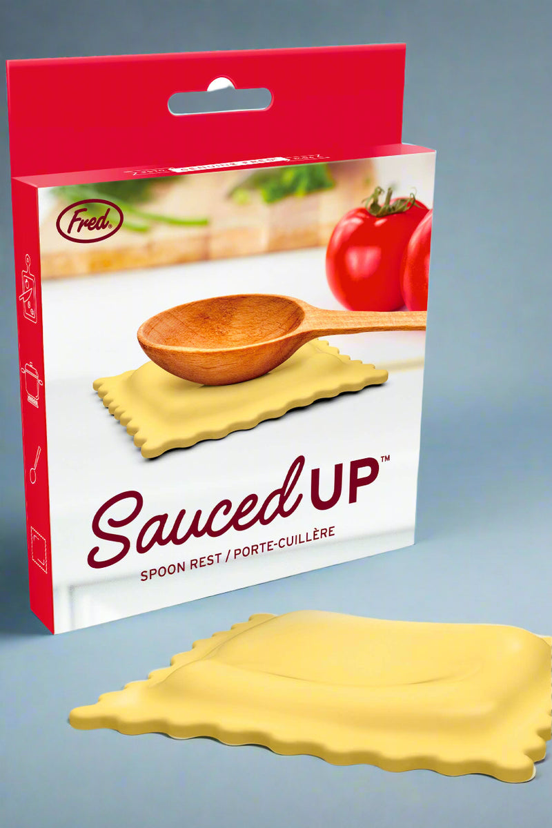 Sauced Up spoon rest packaging with a wooden spoon and ravioli on a white background