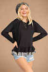 A womens relaxed fit, scoop neck long sleeve shirt with a ruffle hem in black featuring second ruffle under hem in black and white floral print.