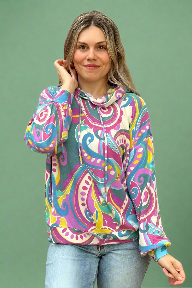 A women’s lightweight hooded top with bold paisley print in fuchsia, teal, and yellow.