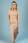 Model is wearing a taupe colored sleeveless maxi dress with exposed seam detailing. 