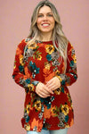 This crew neck long sleeve top is a rust color with a floral pattern. It is an oversized, relaxed fit.