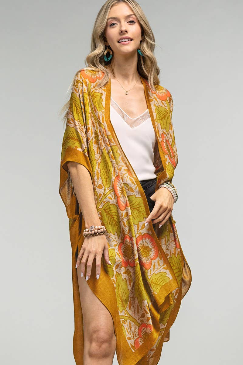 Model is wearing a yellow tone vintage inspired long floral kimono.