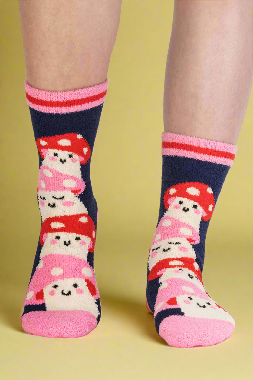 Pair of socks with cartoon character design on a plain background
