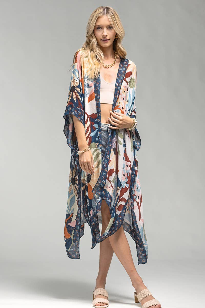 Model is wearing a flowy lightweight multi color floral printed kimono.