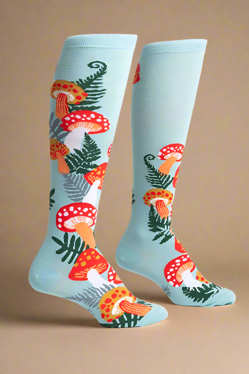 Colorful mushroom-patterned socks on a light blue background