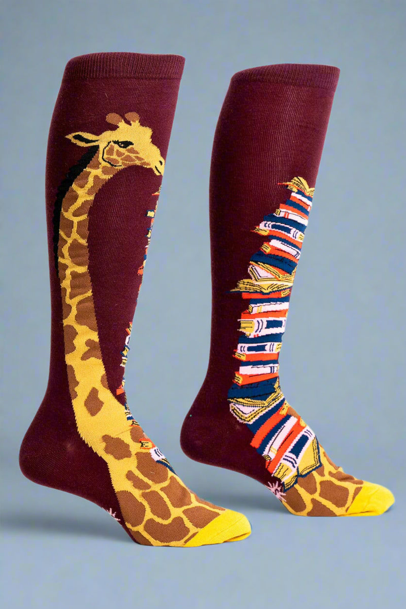 Knee-high socks with giraffe design on a white background