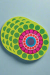 A set of salad plates with brightly colored dot pattern.