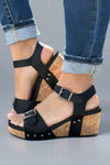 Black studded cork wedge sandals with two adjustable straps and a comfortable footbed. 