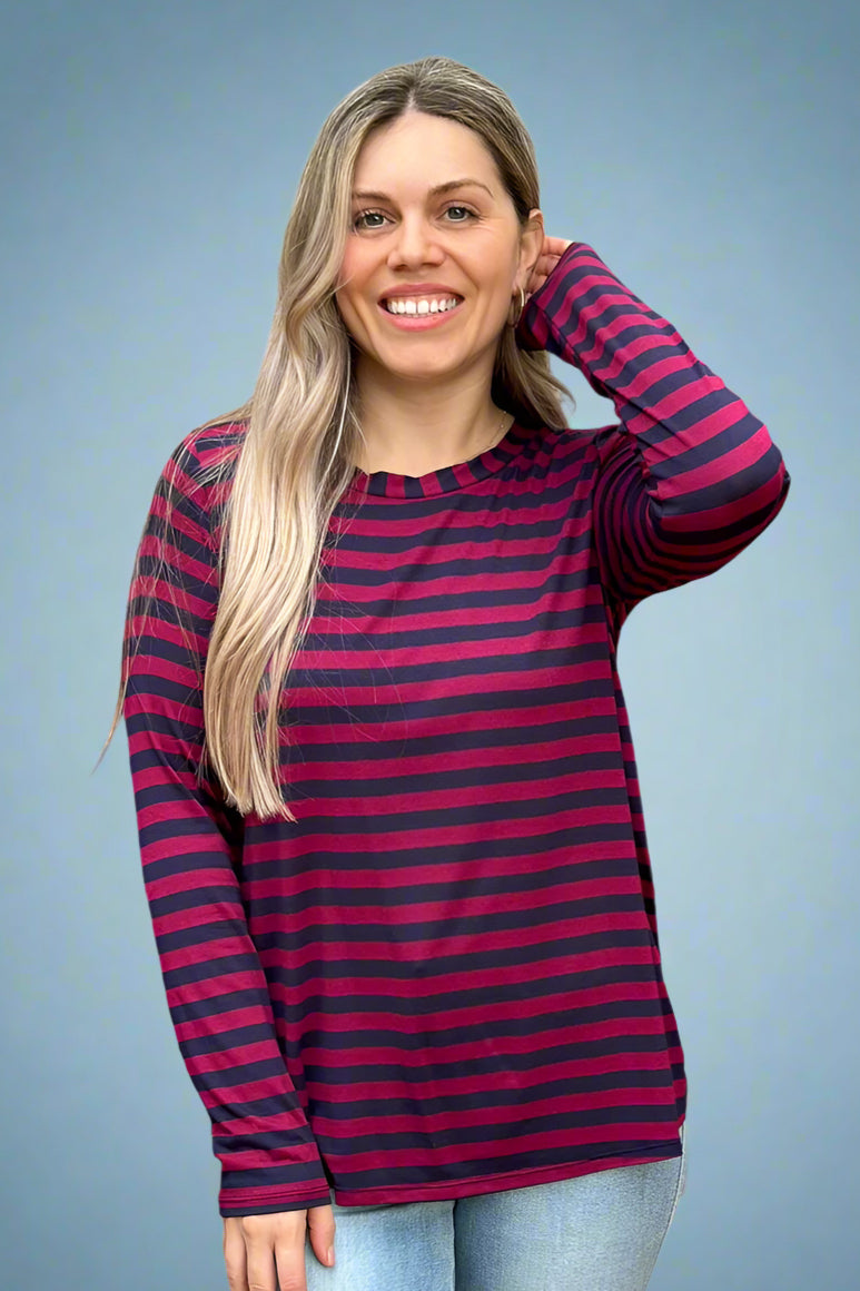 Women’s relaxed fit long sleeve tee with scoop neckline and maroon and navy striped print.
