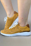 Mustard colored leather sneakers featuring a beautiful perforated design. Includes a removable memory foam gel insert for added comfort. 