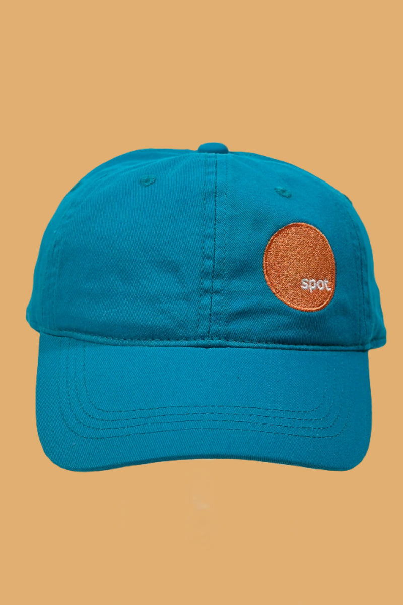 Teal colored cotton baseball cap featuring an embroidered Spot logo.