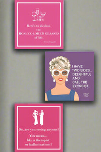 Square beverage napkins in purple and pink. All feature funny phrase on the front.