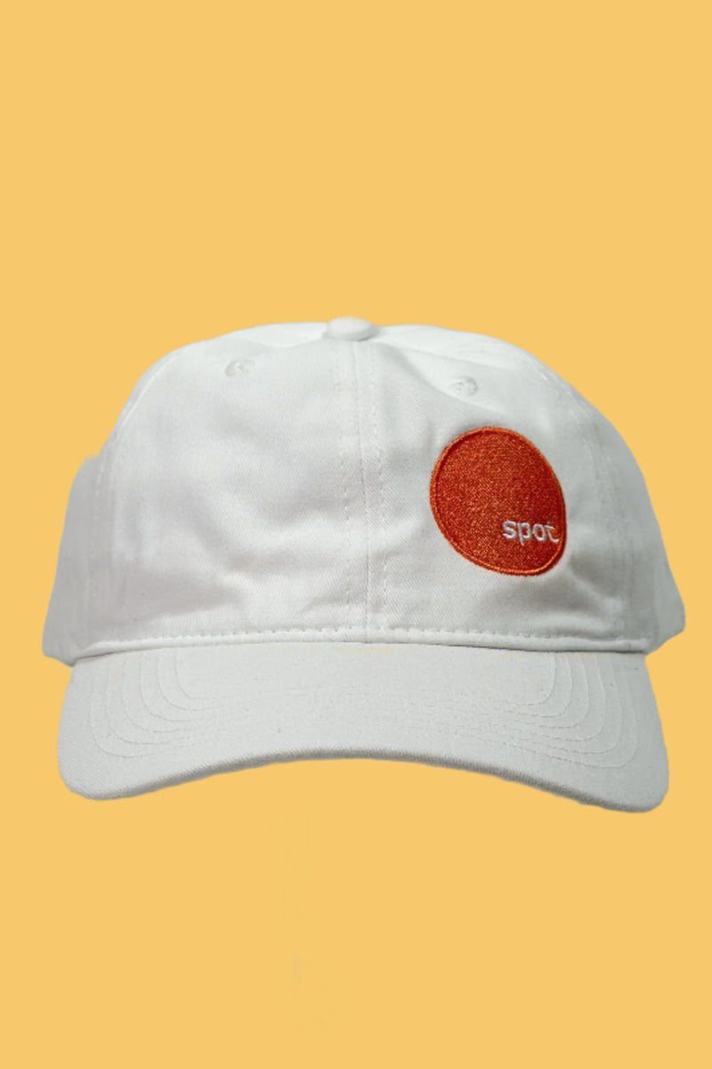 Crisp white colored cotton baseball cap featuring an embroidered Spot logo.