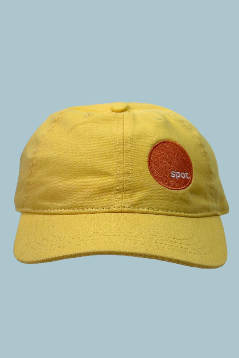 Bright yellow cotton baseball cap featuring an embroidered Spot logo.