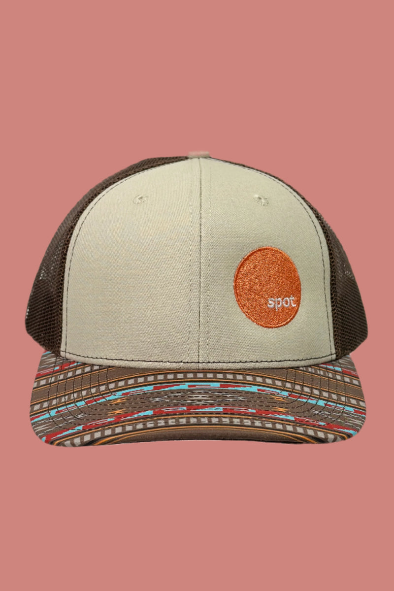 Aztec printed brim trucker hat featuring an embroidered Spot logo. 
