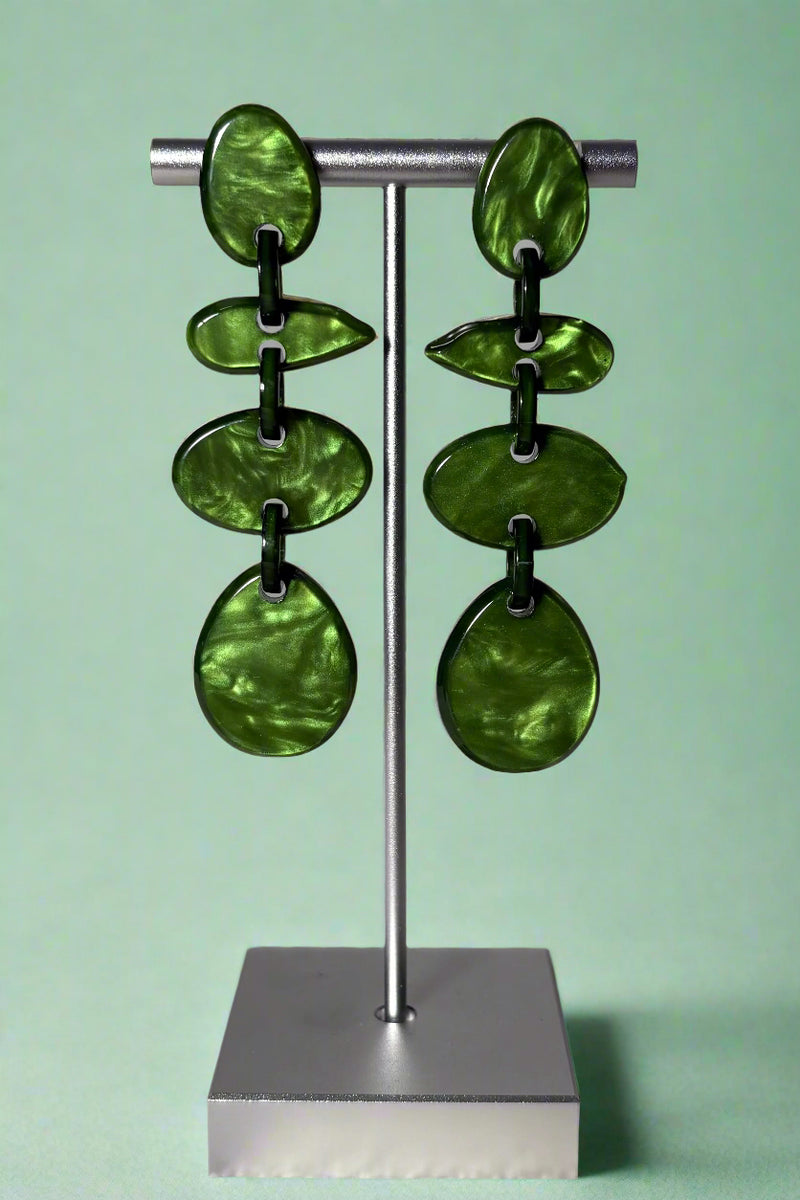 Green colored acrylic abstract earrings that have four tiers. 