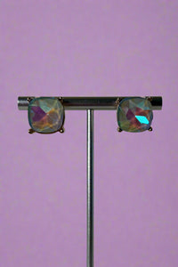 Large glass stud earrings with gold backings and a grey/opal inspired glass stone.