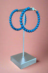 Lightweight Teal colored acrylic bubble hoop earrings.