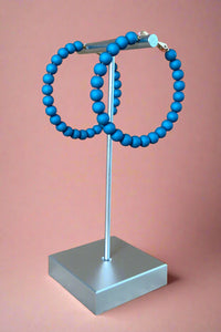 Lightweight Teal colored acrylic bubble hoop earrings.