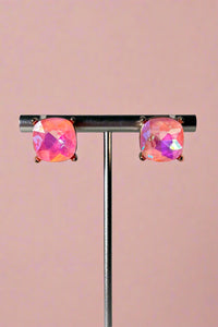 Light blush pink colored glass stud earrings with gold colored backings. 