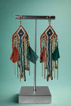 Multi color beaded boho earrings featuring feather details. 